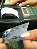 Image of a consumer making a purchase with a credit card